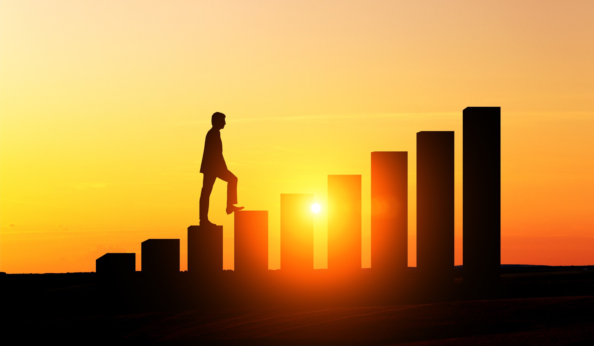 Success concept with businessman silhouette climbing